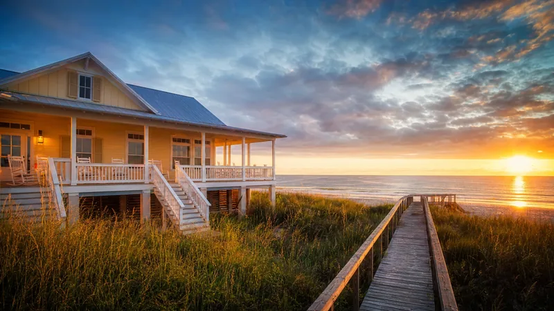 A pastel beach cottage with a porch and dune walkover at sunset, Monroe County and Key West Business License